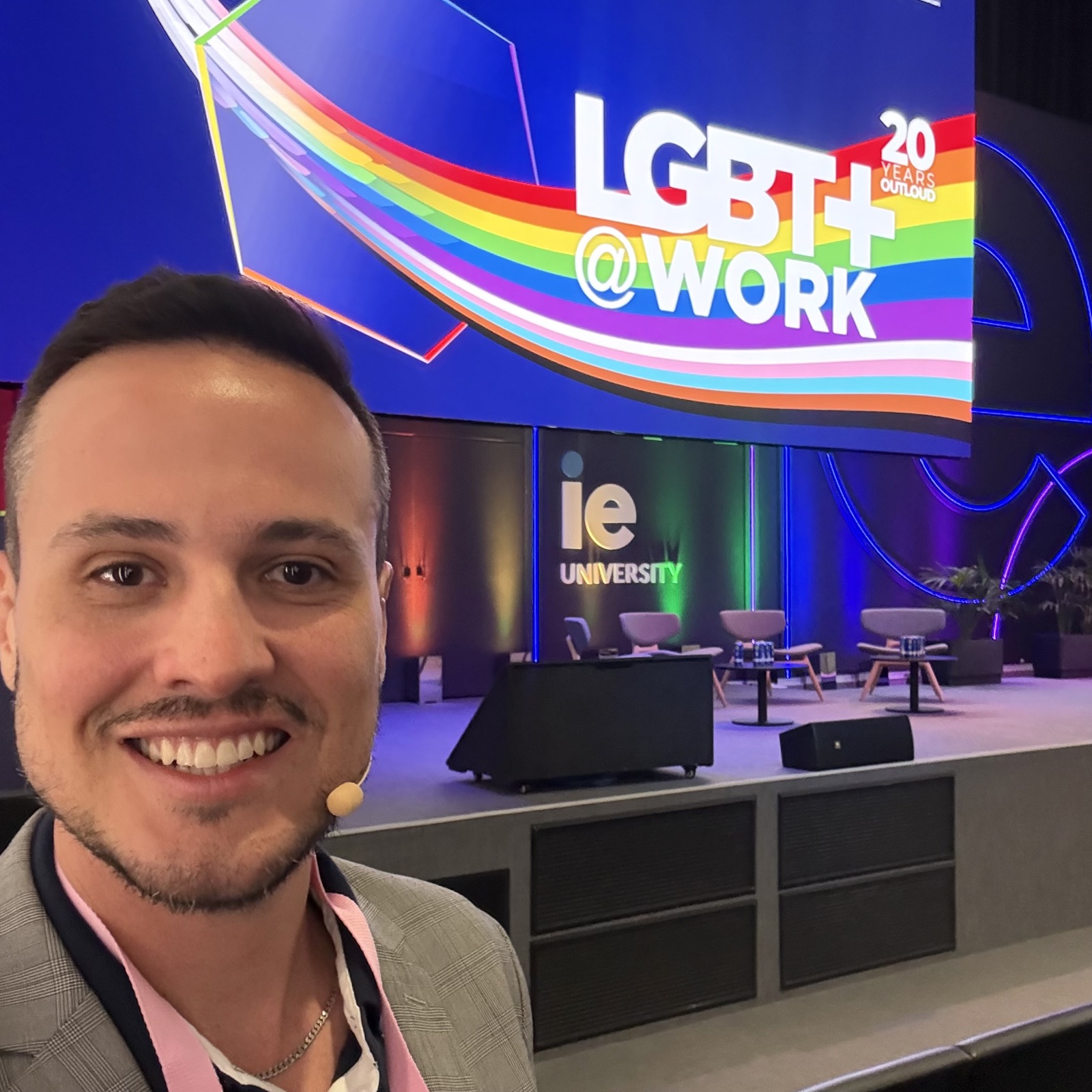 Thiago Ferreira in front of the LGBT+@Work 20 Years Out Loud stage at IE University Madrid