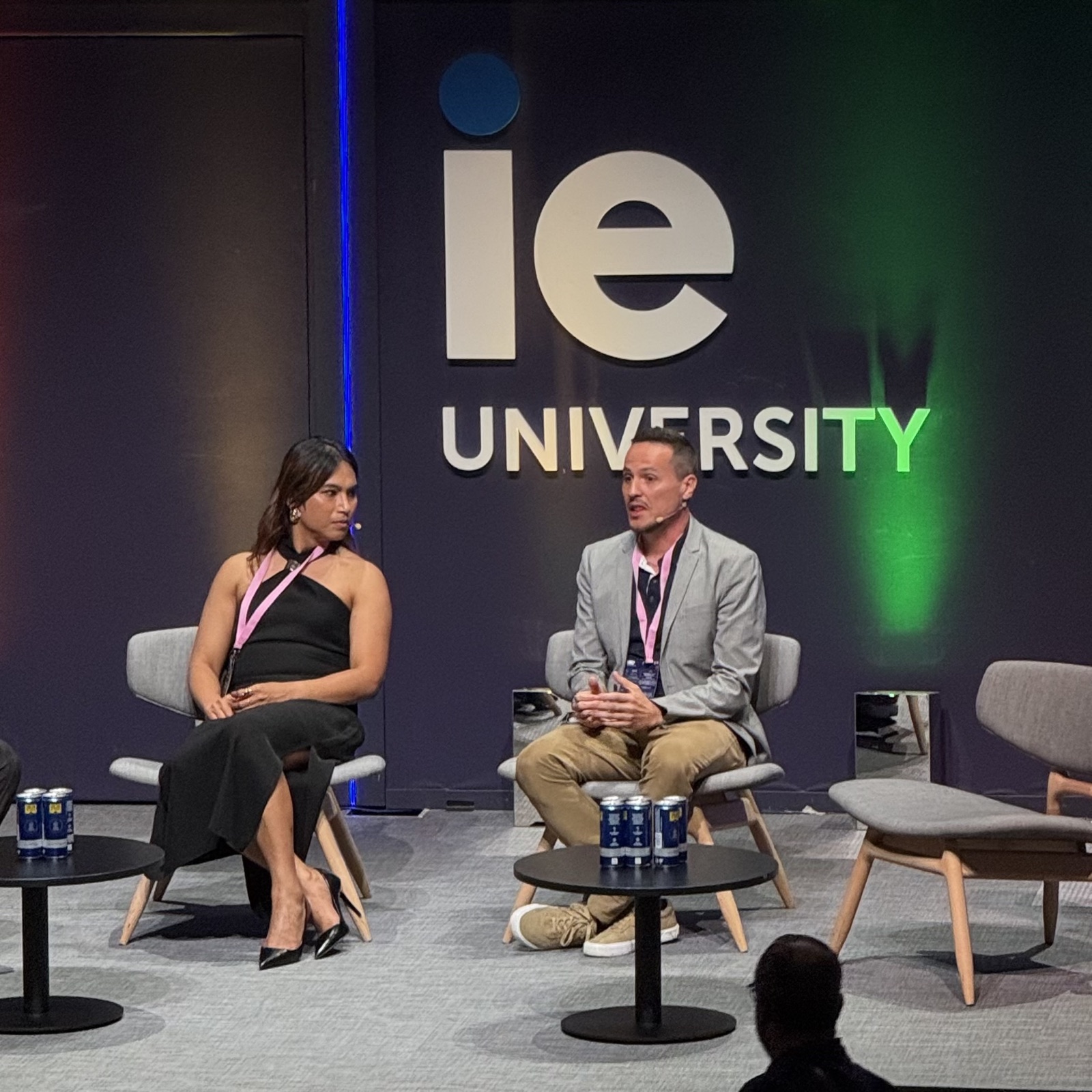 Thiago Ferreira and Mela Habijan seated on stage at LGBT+@Work 2026, IE University